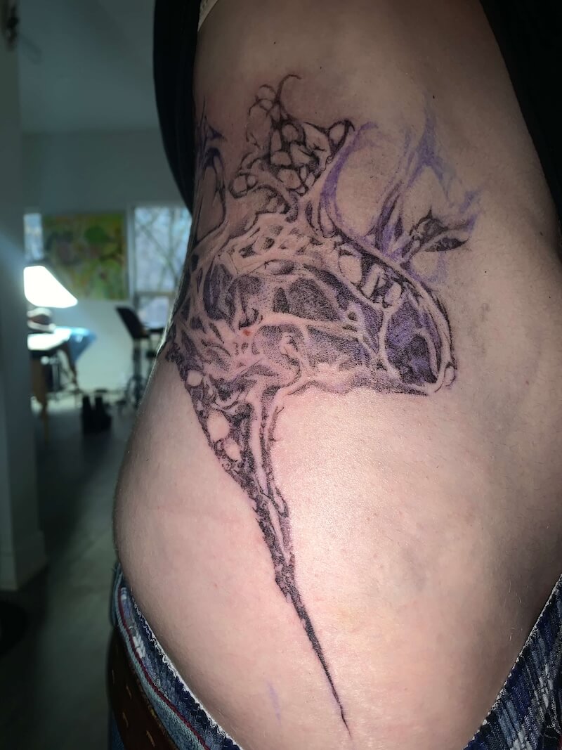 An organic tattoo on the hip